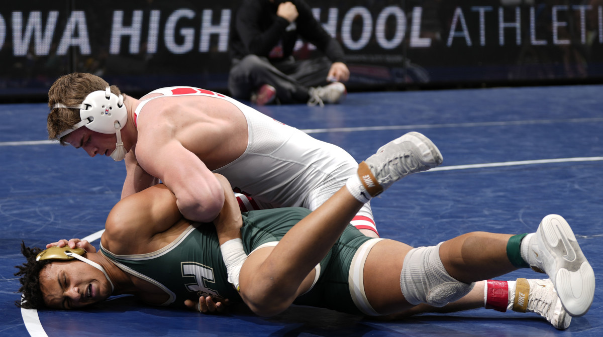 Iowa City High's Ben Kueter won his fourth straight state championship Saturday night and finished his career undefeated. 